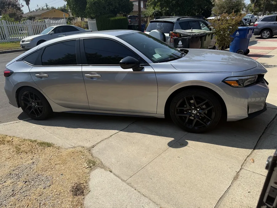 Silver Honda Civic with tinted windows
